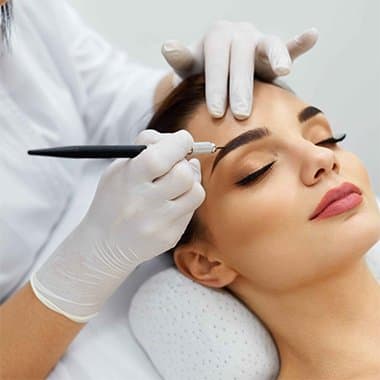 Close-up of finished permanent makeup brows